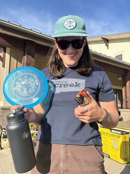 A player grinning with her new disc