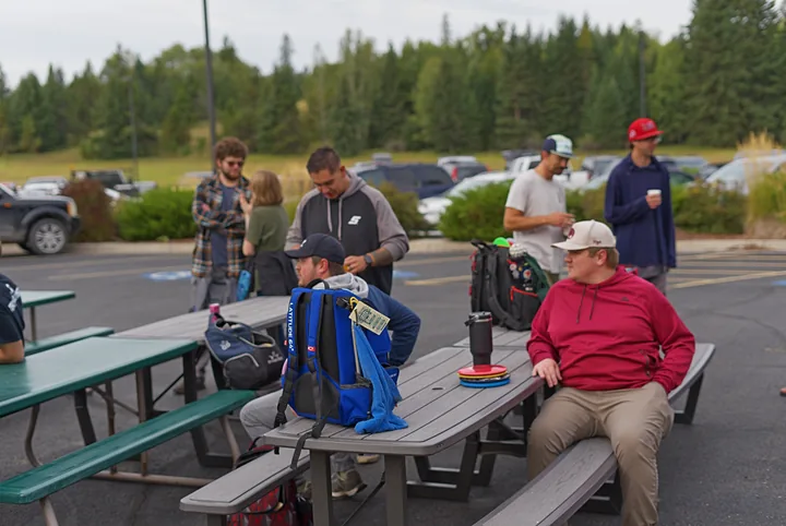 Players at the picnic tables