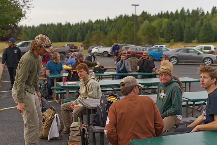 Players at the picnic tables