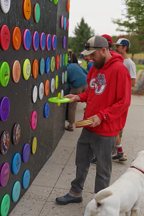 A player picking a disc from the wall