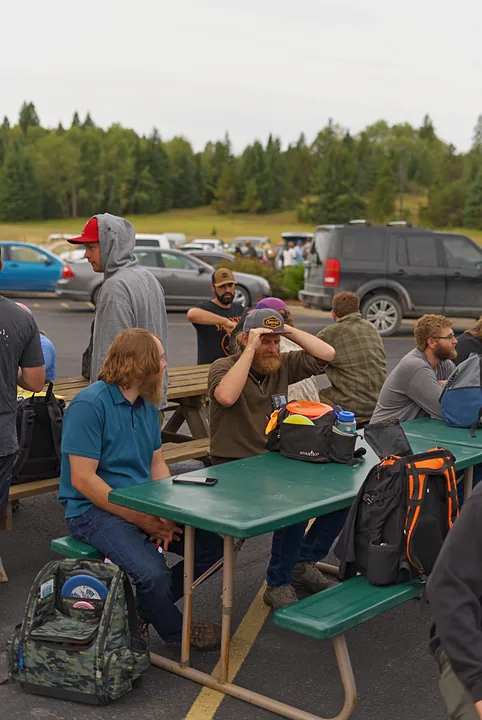 Players at the picnic tables