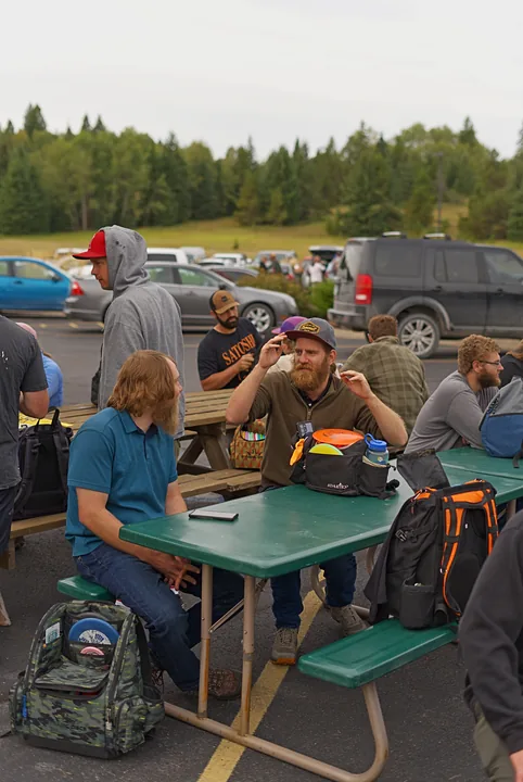 Players at the picnic tables