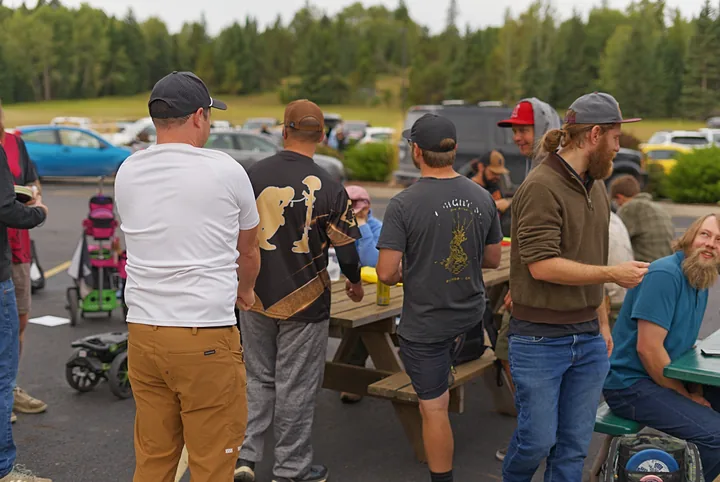 Players at the picnic tables