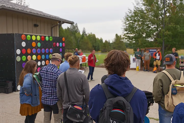 The player meeting in front of the disc wall