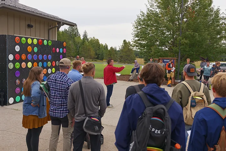 The player meeting in front of the disc wall
